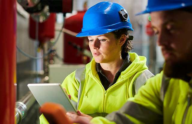 workers wearing hardhats on a job site