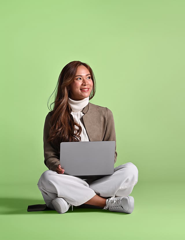 woman sitting while working on a computer