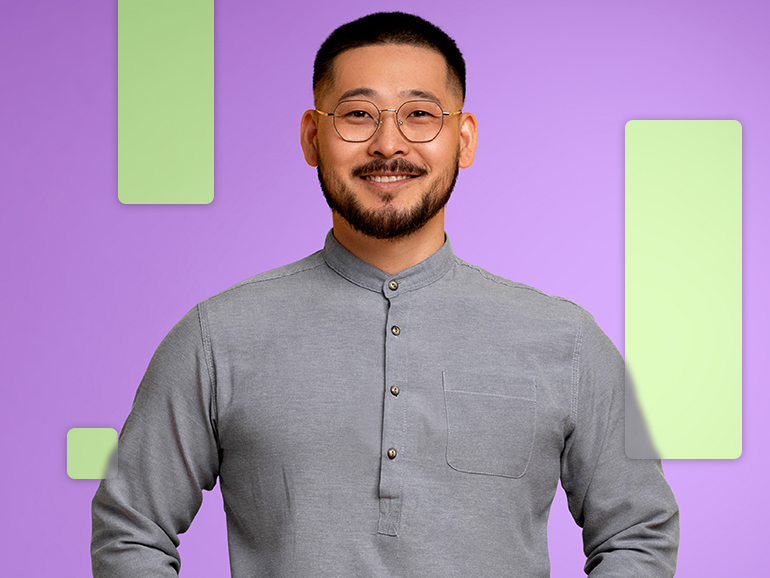 man wearing a grey quarter button down