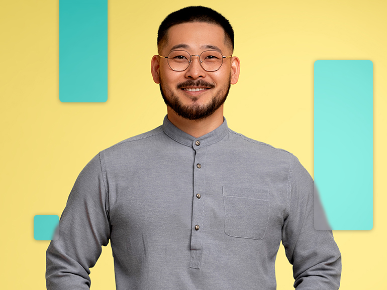 man wearing a grey quarter button down