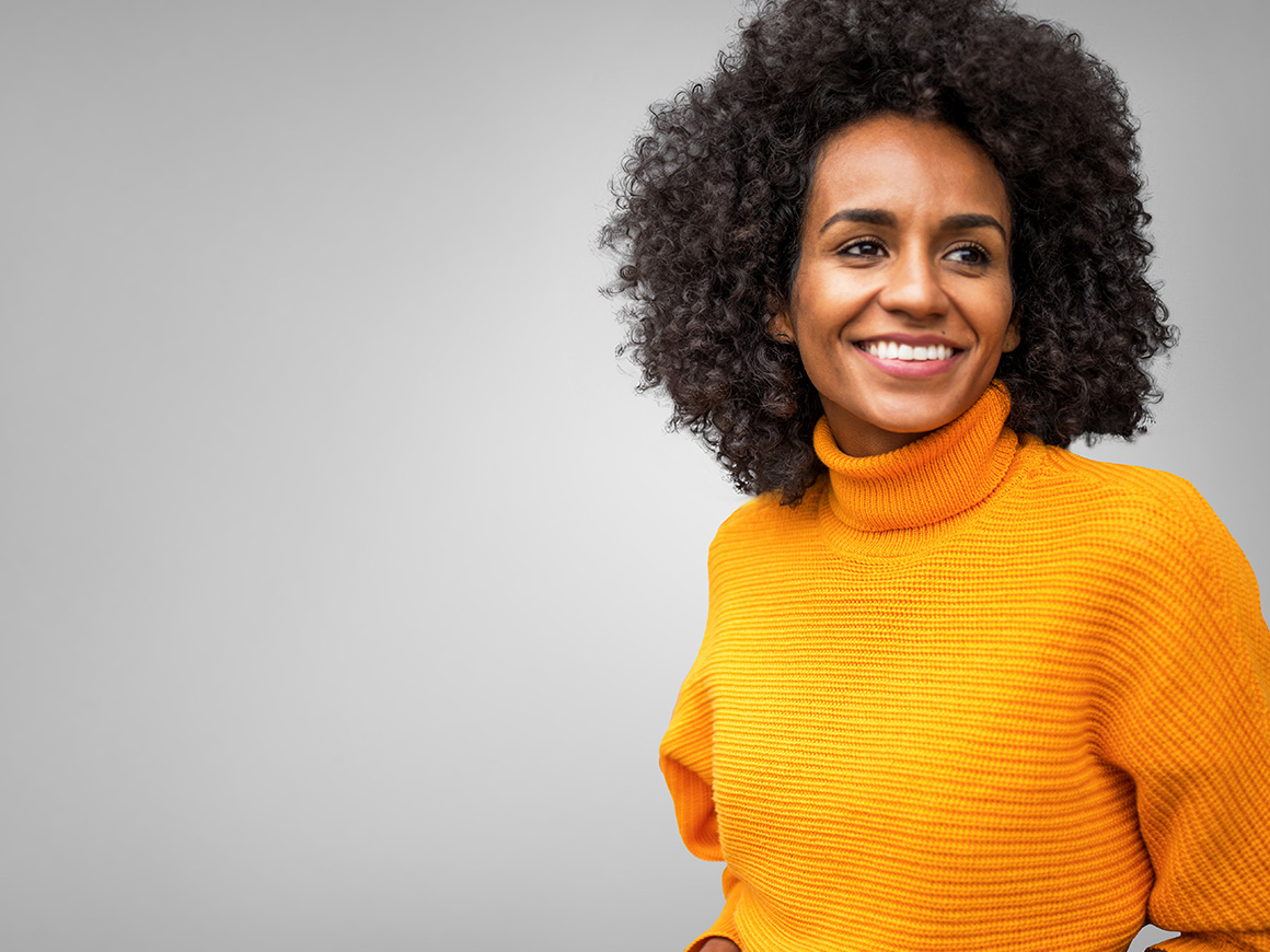 woman wearing orange sweater