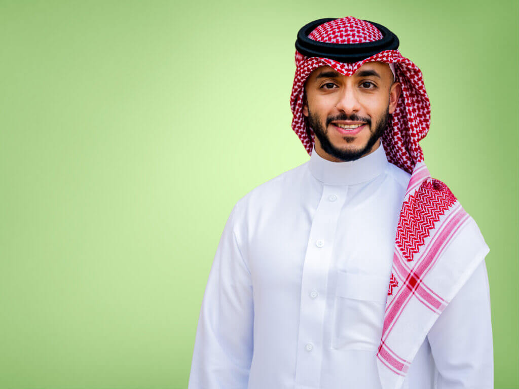 man with arms crossed smiling