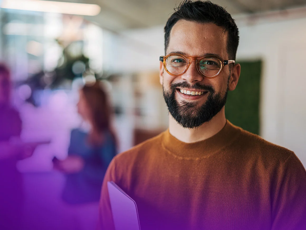 man wearing glasses smiling