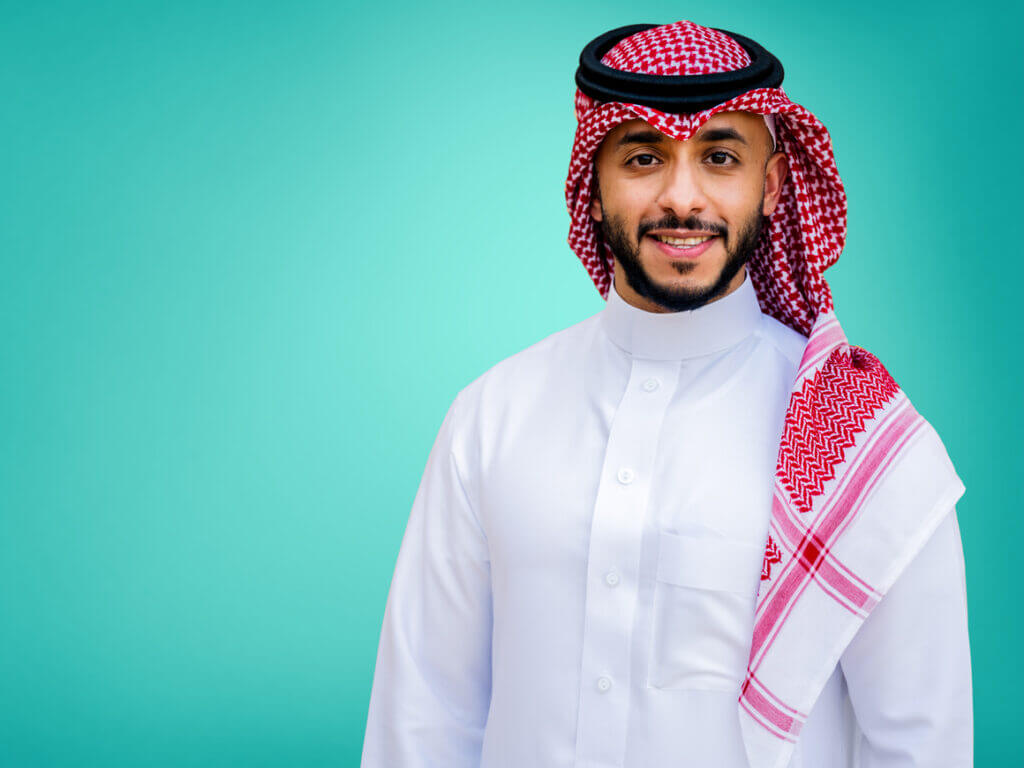 man with arms crossed smiling