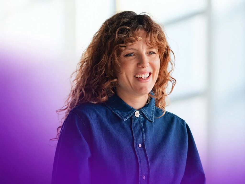 woman wearing a blue shirt talking