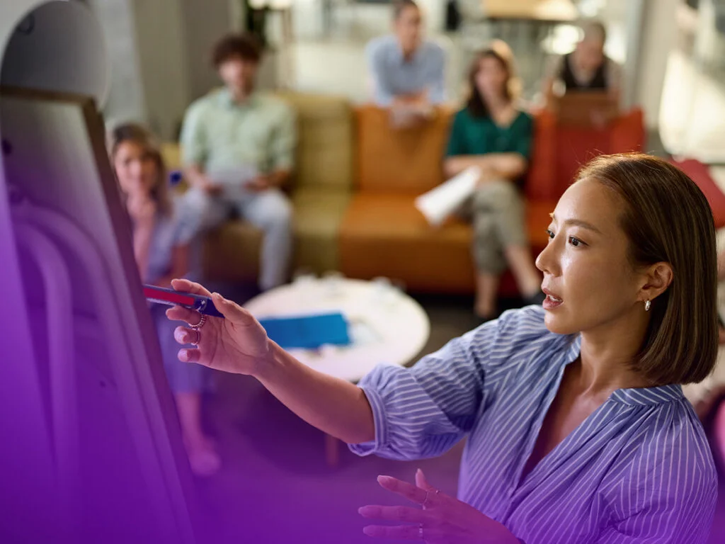 woman presenting in front of a crowd