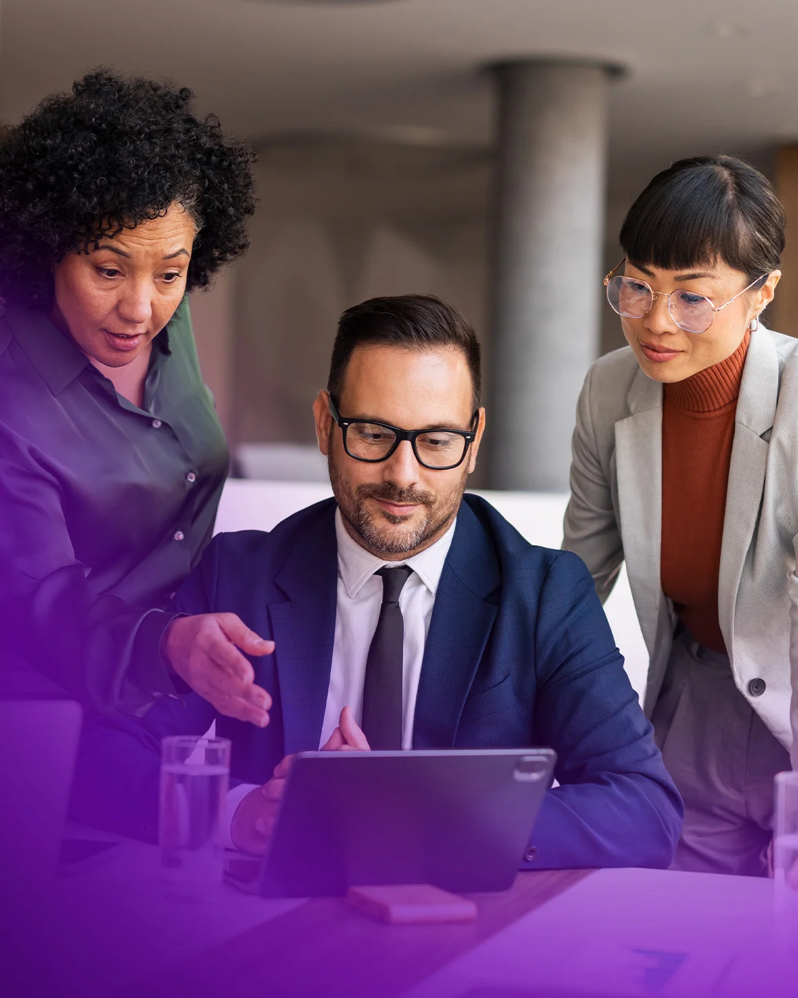 group of people working on a laptop