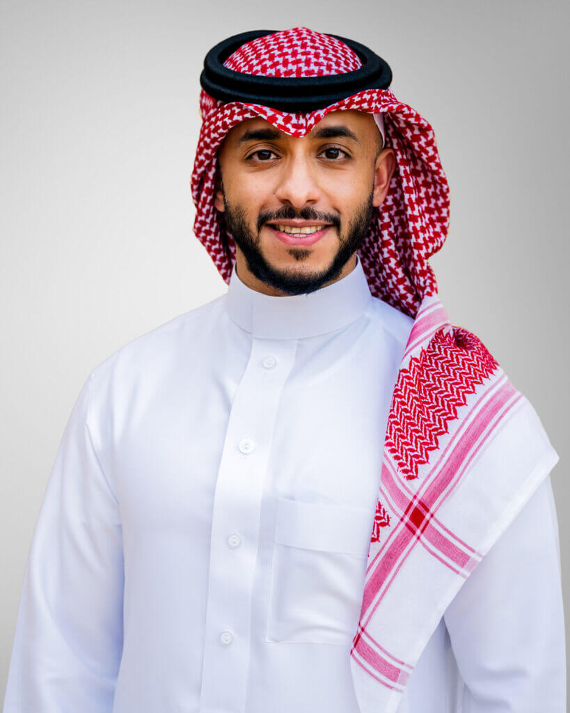 man with arms crossed smiling