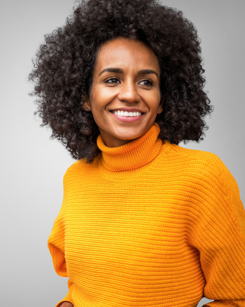 woman wearing orange sweater