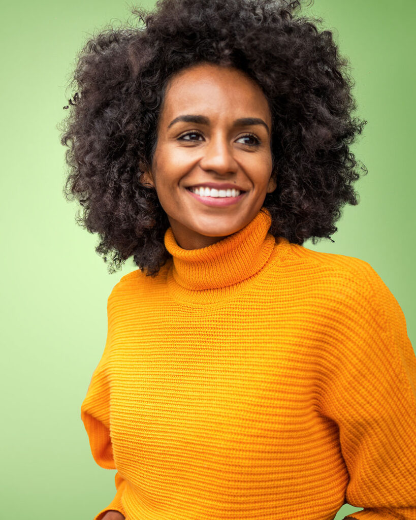 woman wearing orange sweater