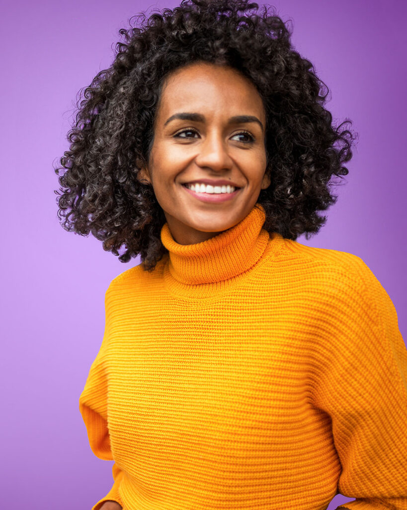 woman wearing orange sweater