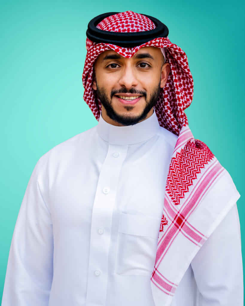 man with arms crossed smiling