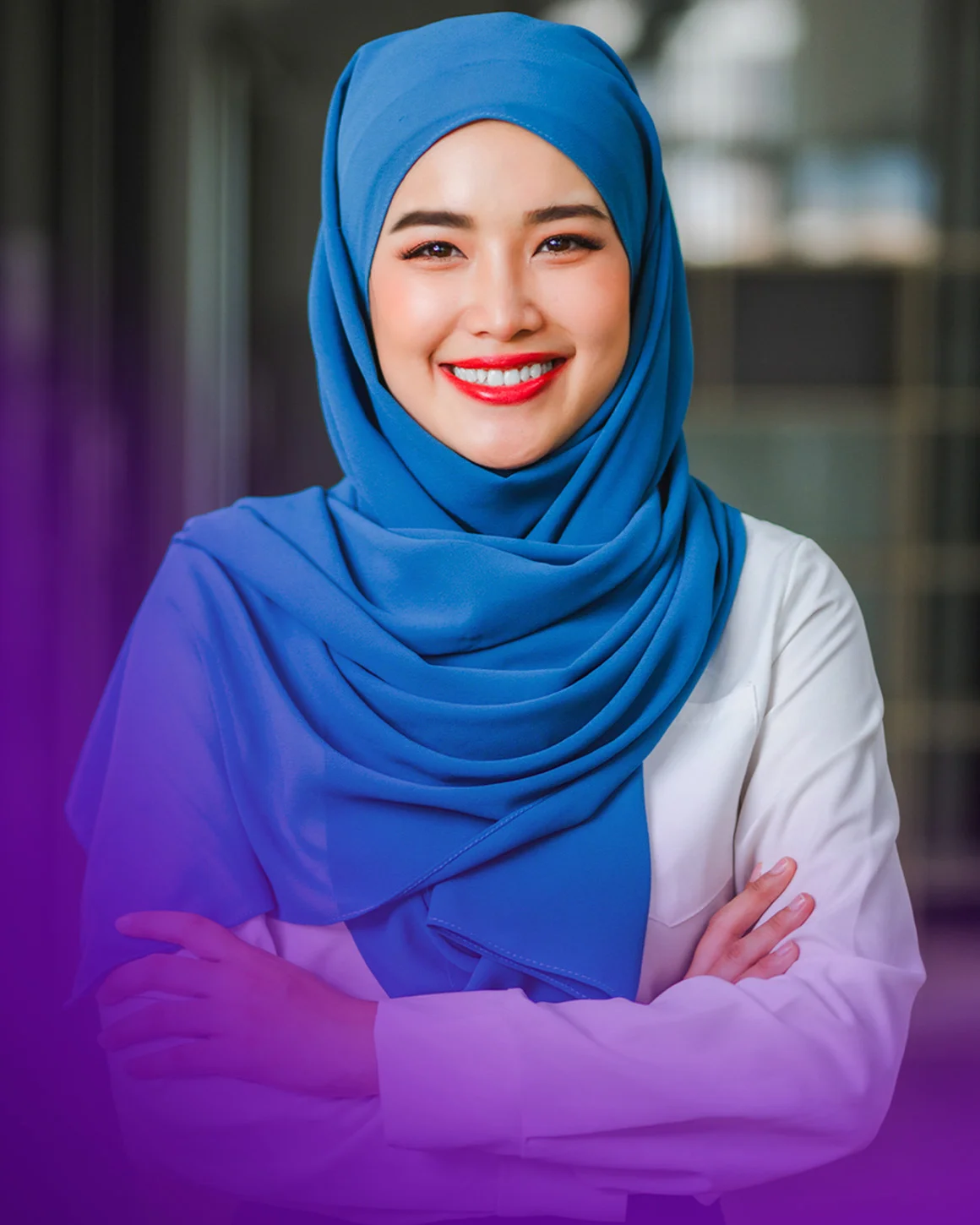 woman with her arms crossed smiling