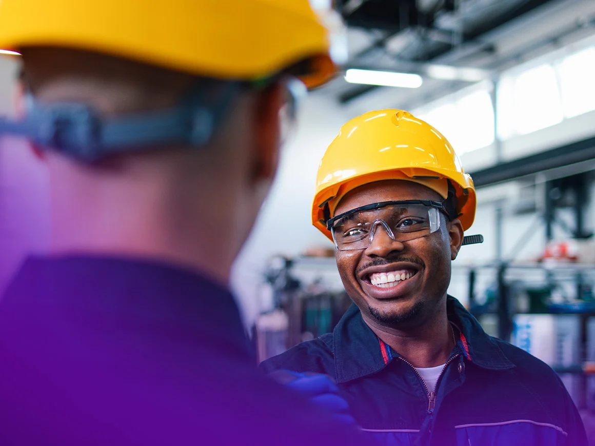 man wearing a hardhat and earphones