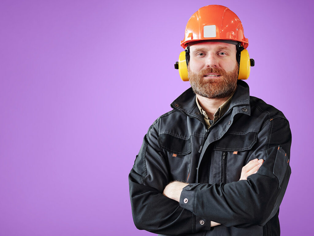 man wearing a hardhat and earphones