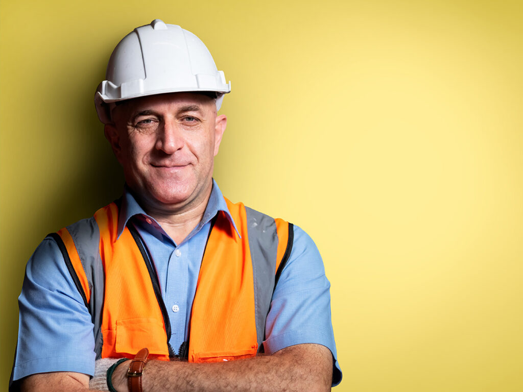 man wearing a safety vest and hardhat