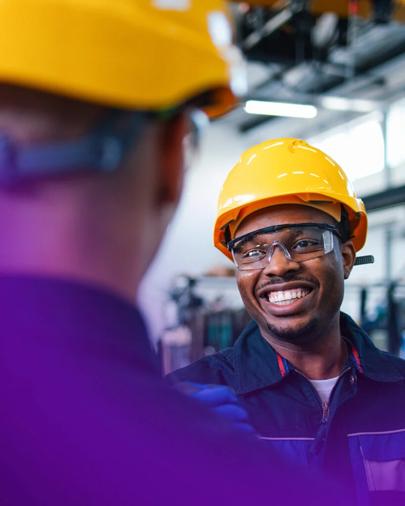 man wearing hardhat and smiling