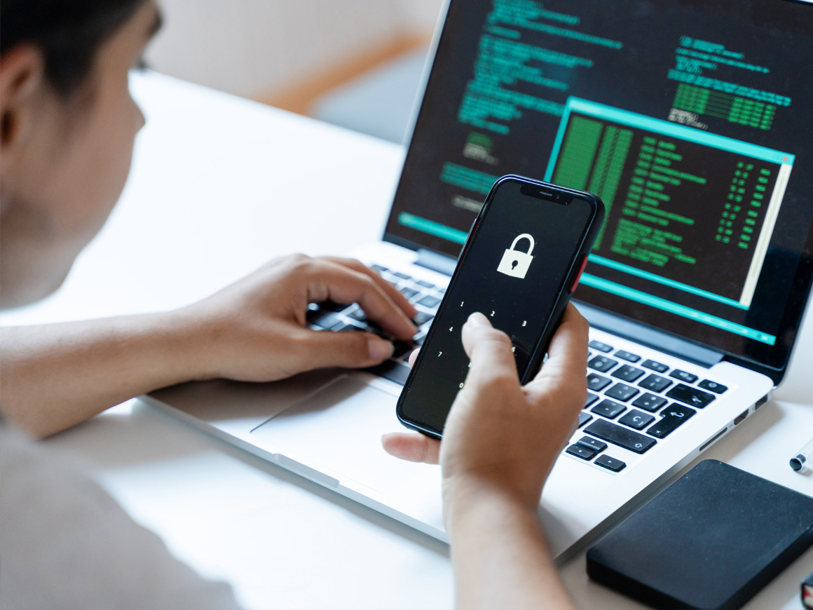 woman holding smartphone with a lock on the screen